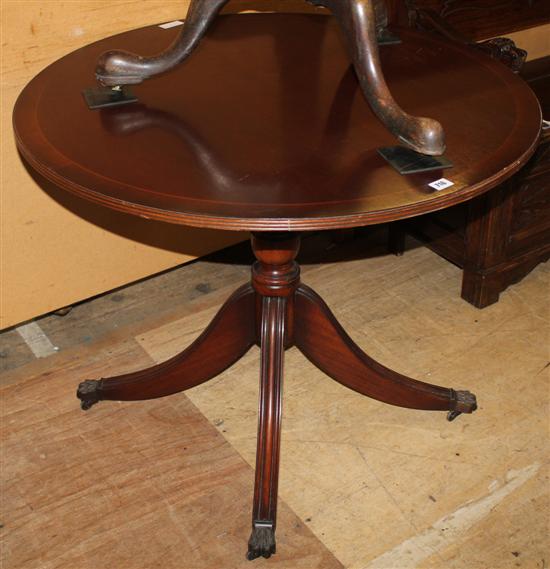 Circular mahogany snap top table